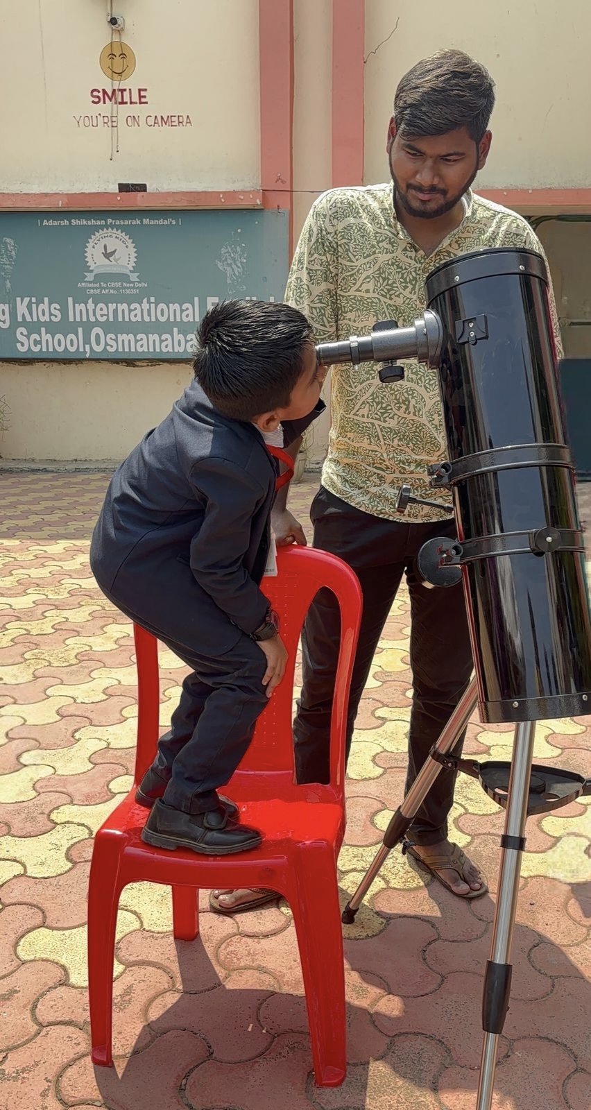 Flying Kids International School student observing the sun during Astrophiles solar observation workshop in Dharashiv
